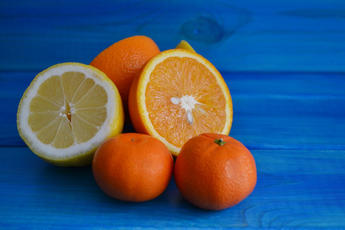 Oranges on Blue Table Providing Vitamin C Boost